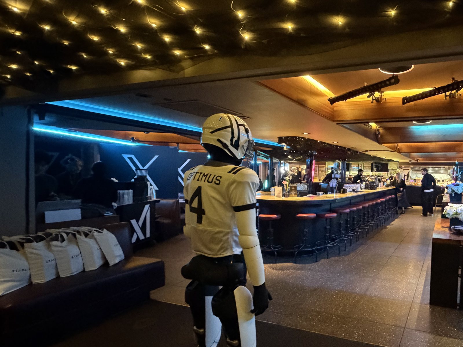 Optimus in an X Football City Diner jersey inside the transformed diner